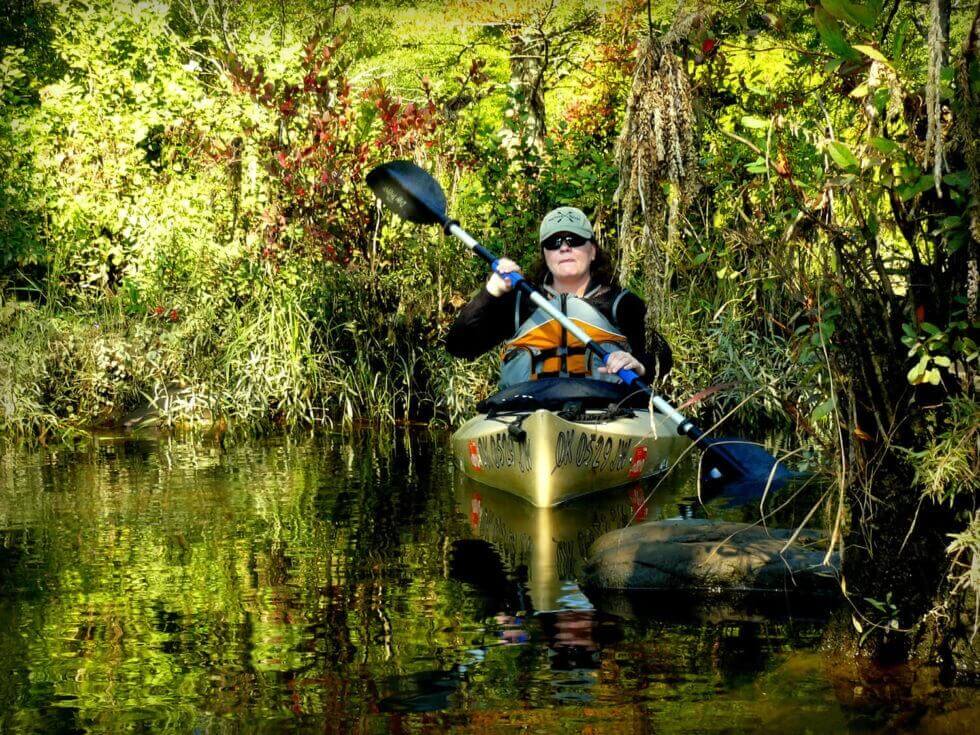 woman kayaking on Broken Bow Lake