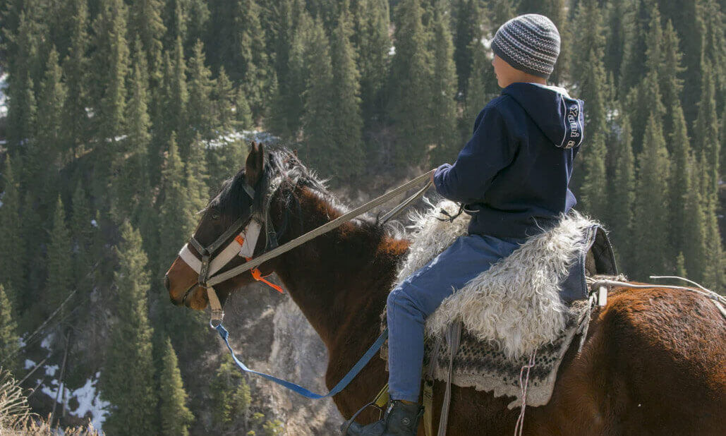 kid horseback riding at McCurtain County ridge